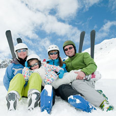 family skiing at a ski resort